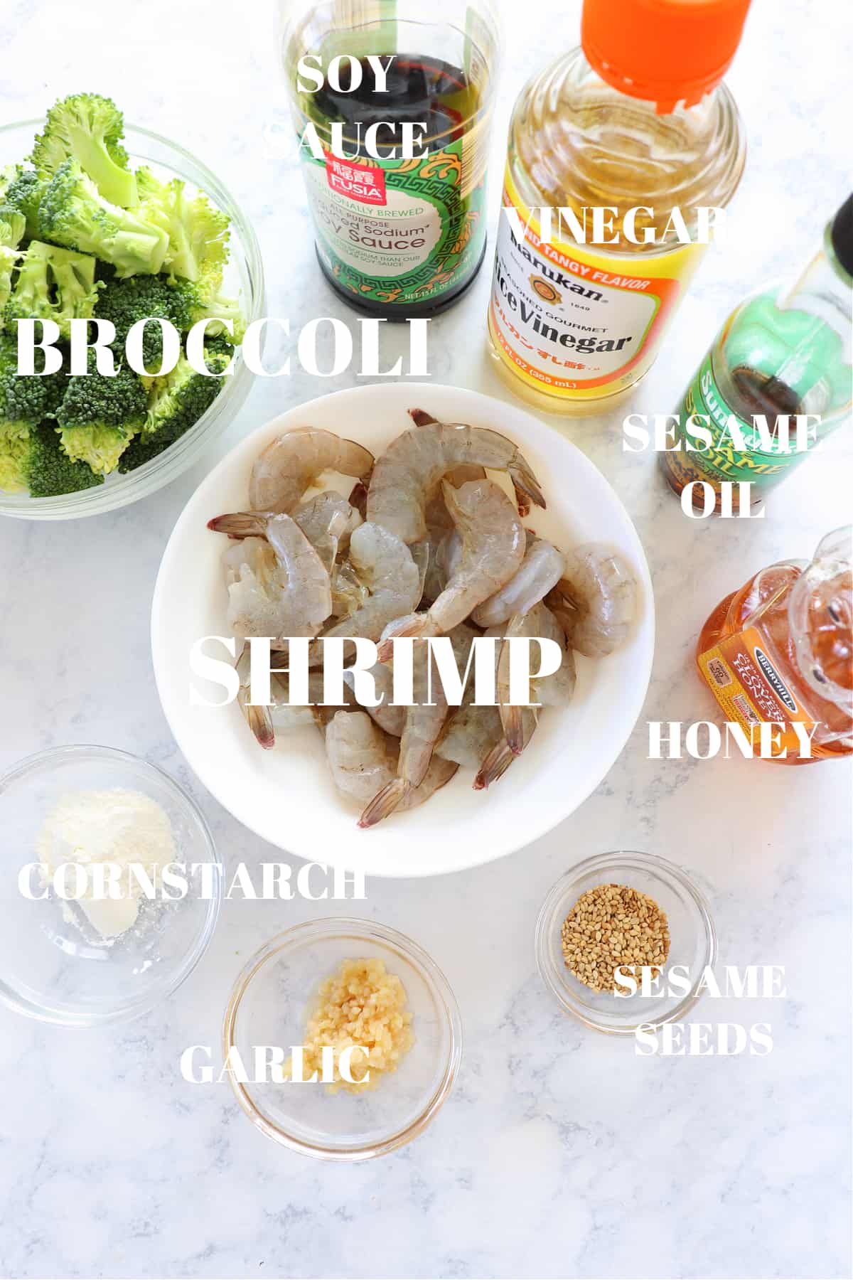 Ingredients for shrimp and broccoli stir fry on a board.