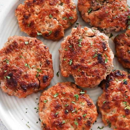 Breakfast sausage patties on a plate.