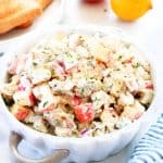 Turkey salad in a bowl on a board.