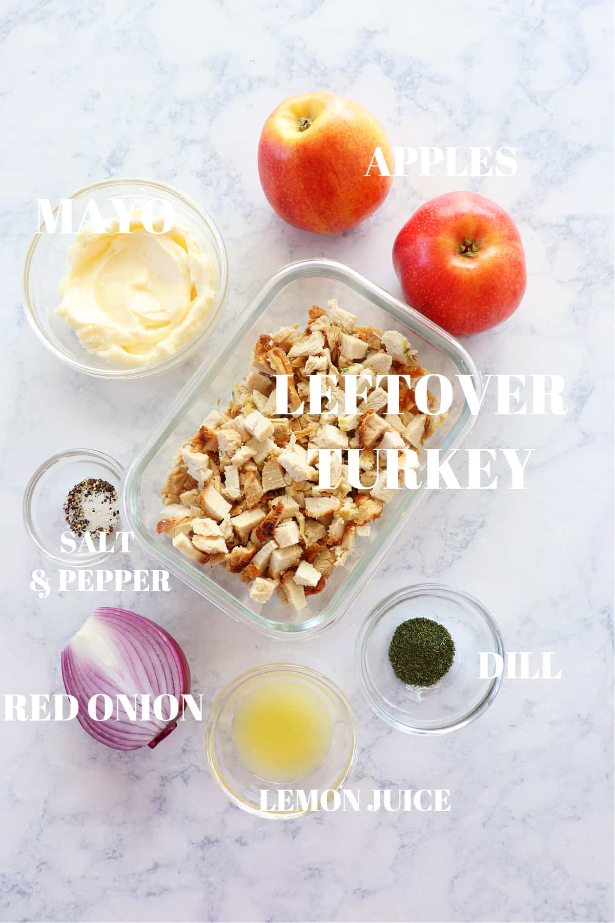 Ingredients for turkey salad on a board.
