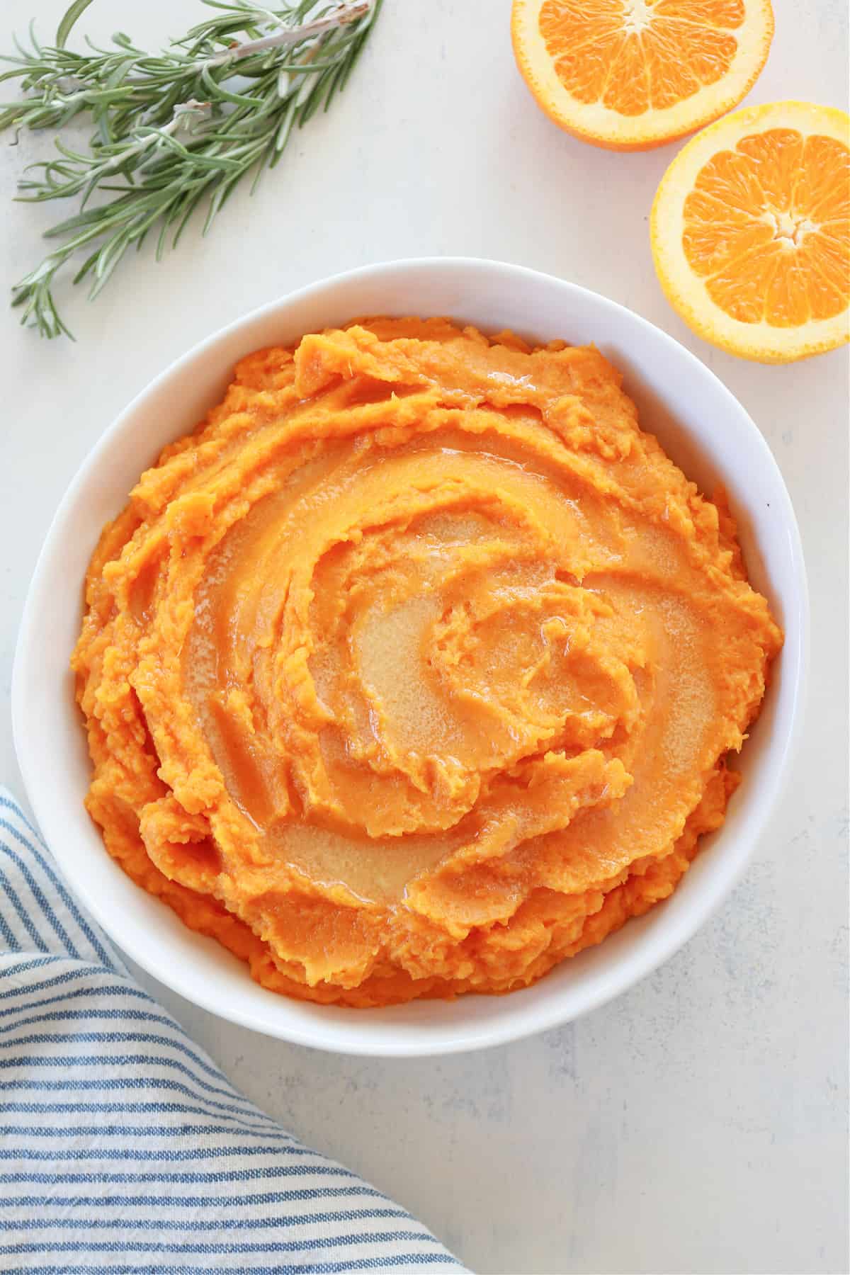 Mashed sweet potatoes in a serving bowl.