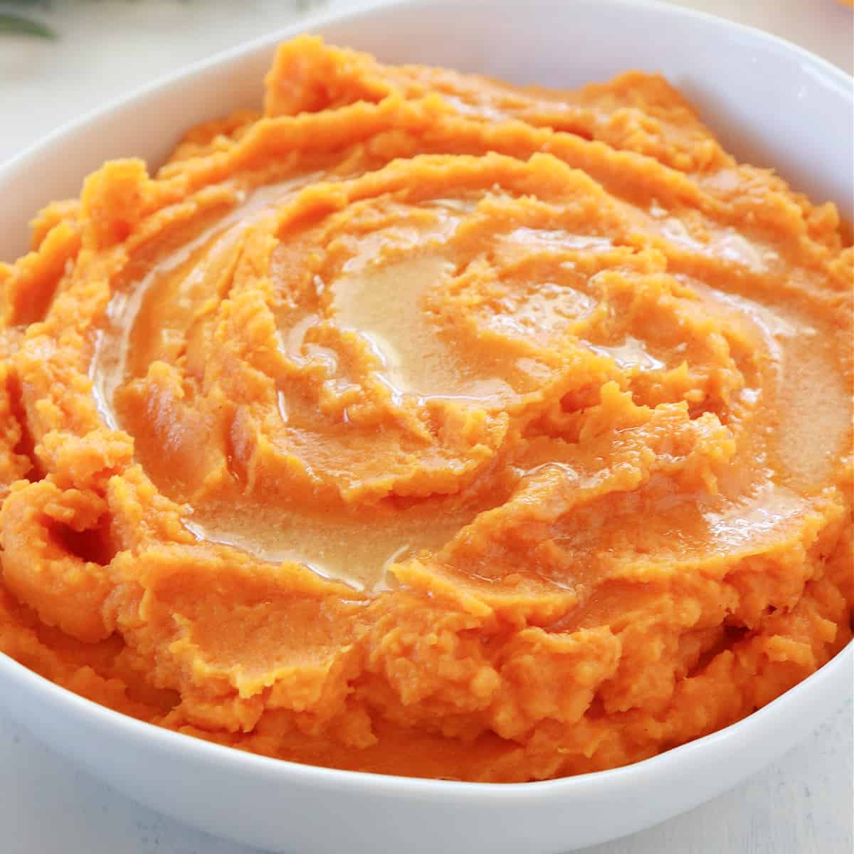 Mashed sweet potatoes in a bowl.