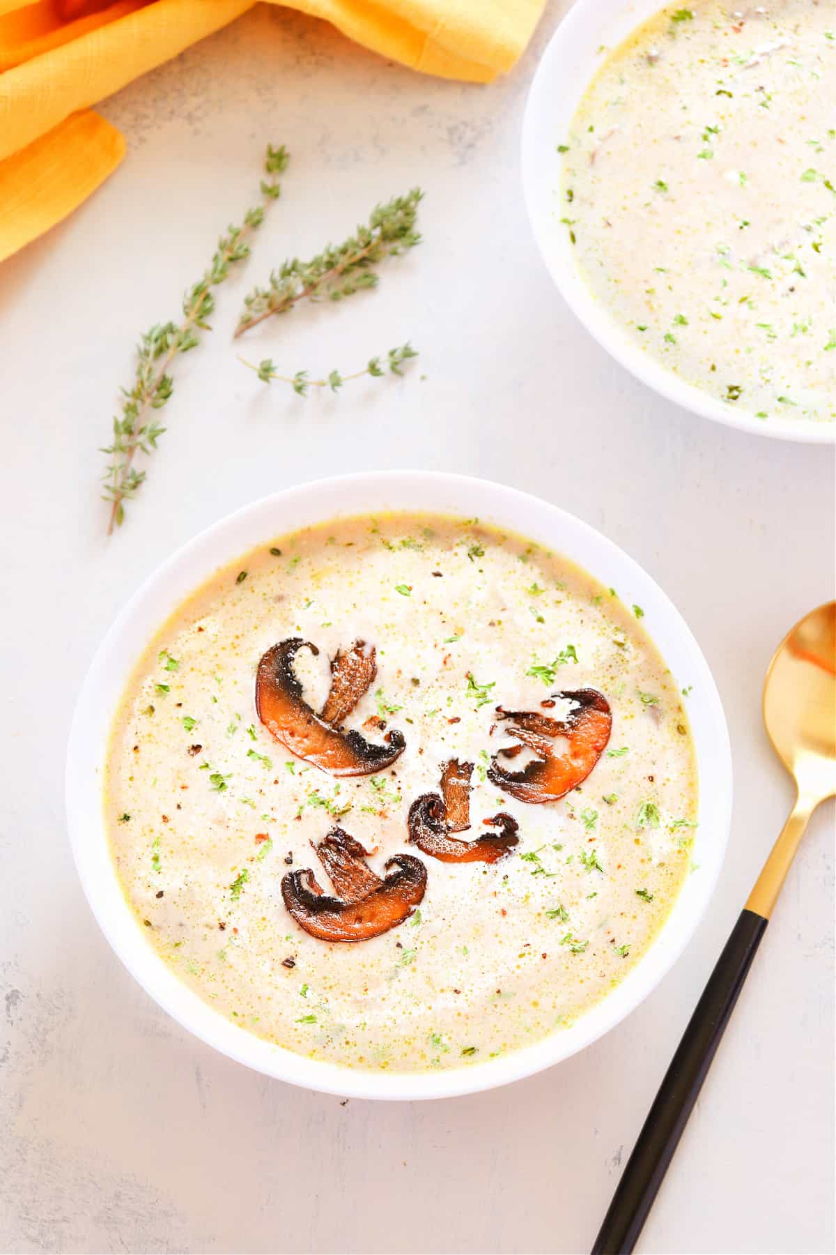 Creamy mushroom soup in a white bowl.