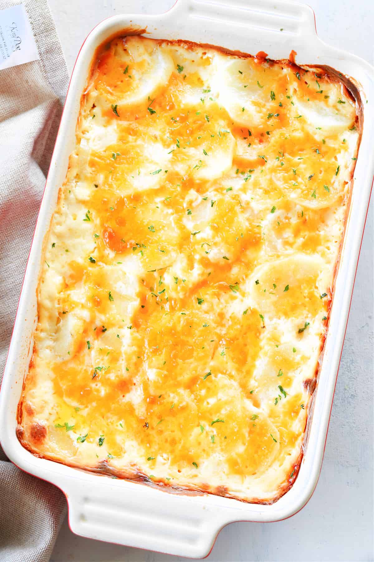 Scalloped potatoes in a baking dish.