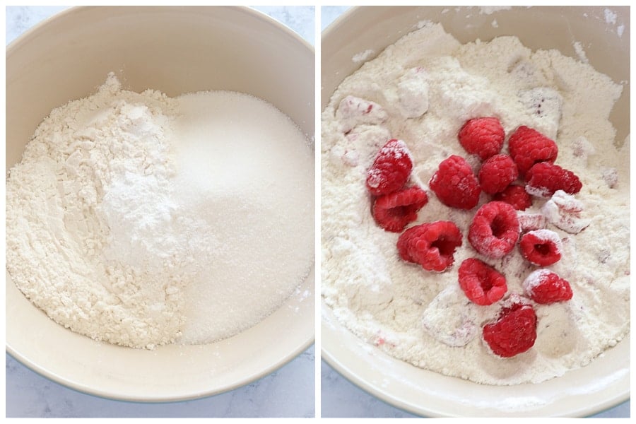 Dry ingredients and raspberries in a mixing bowl.