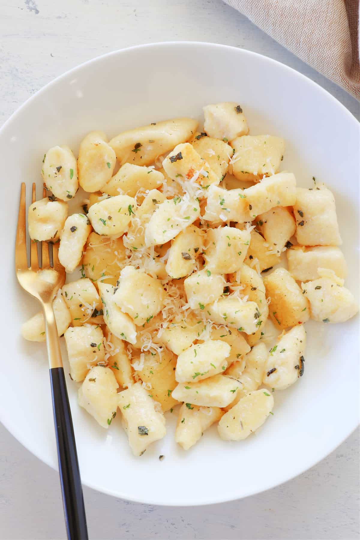 Gnocchi in a white bowl.