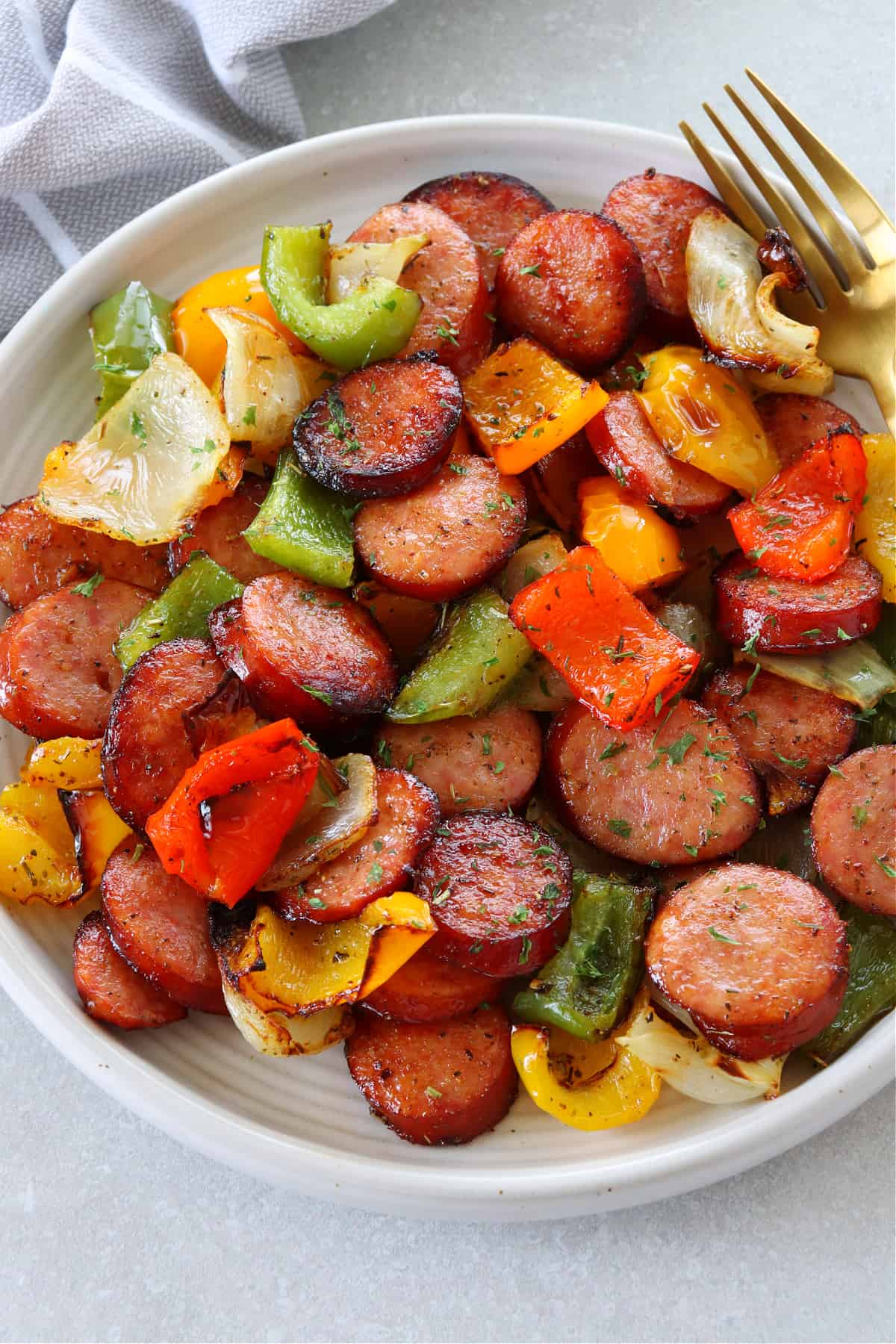 Sausage and veggies on a plate.