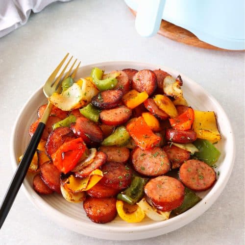 Air fried sausage and veggies on a plate.