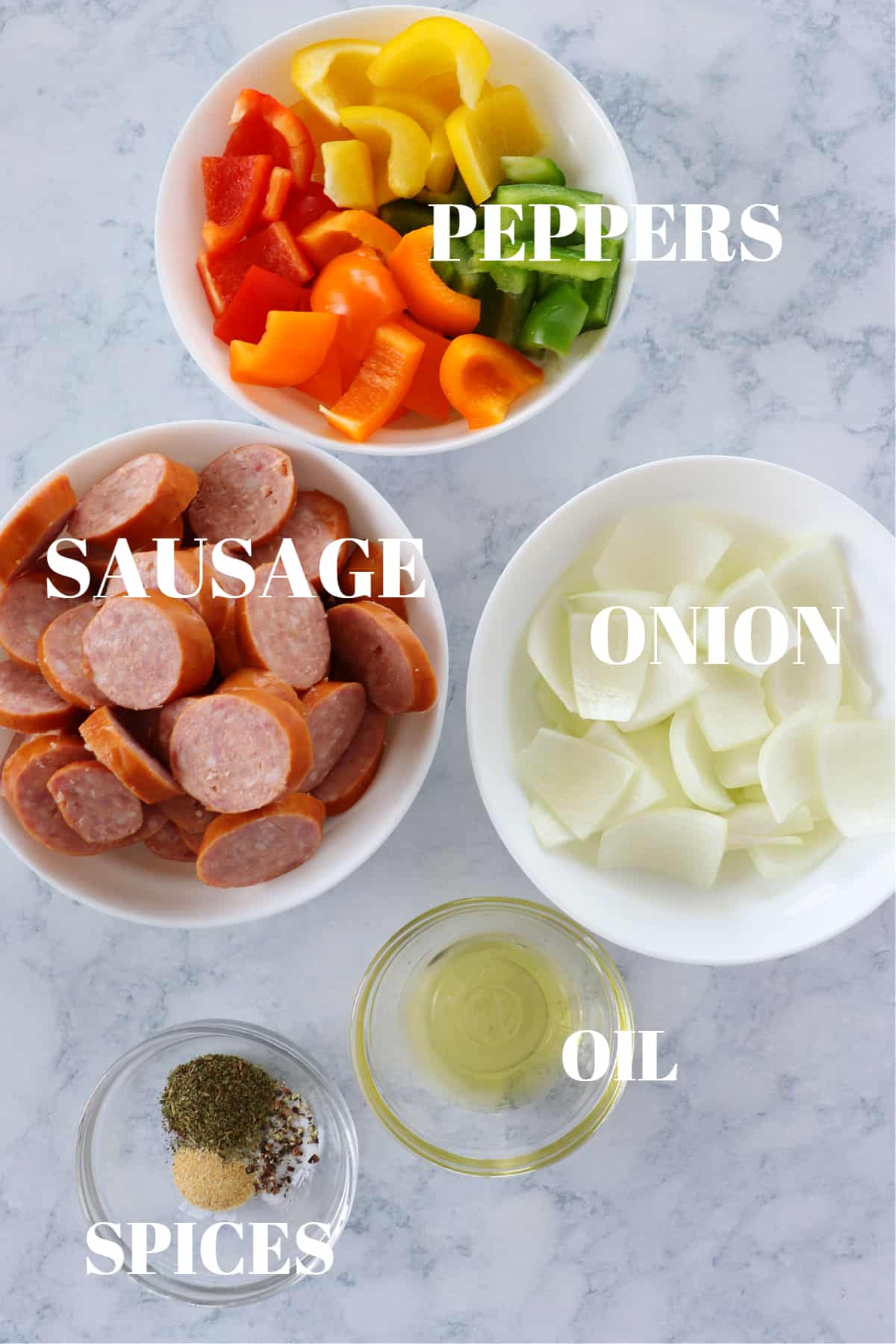 Ingredients for air fryer sausage on a marble board.