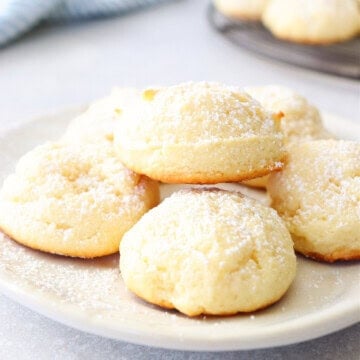 Cream cheese cookies on a small white plate.