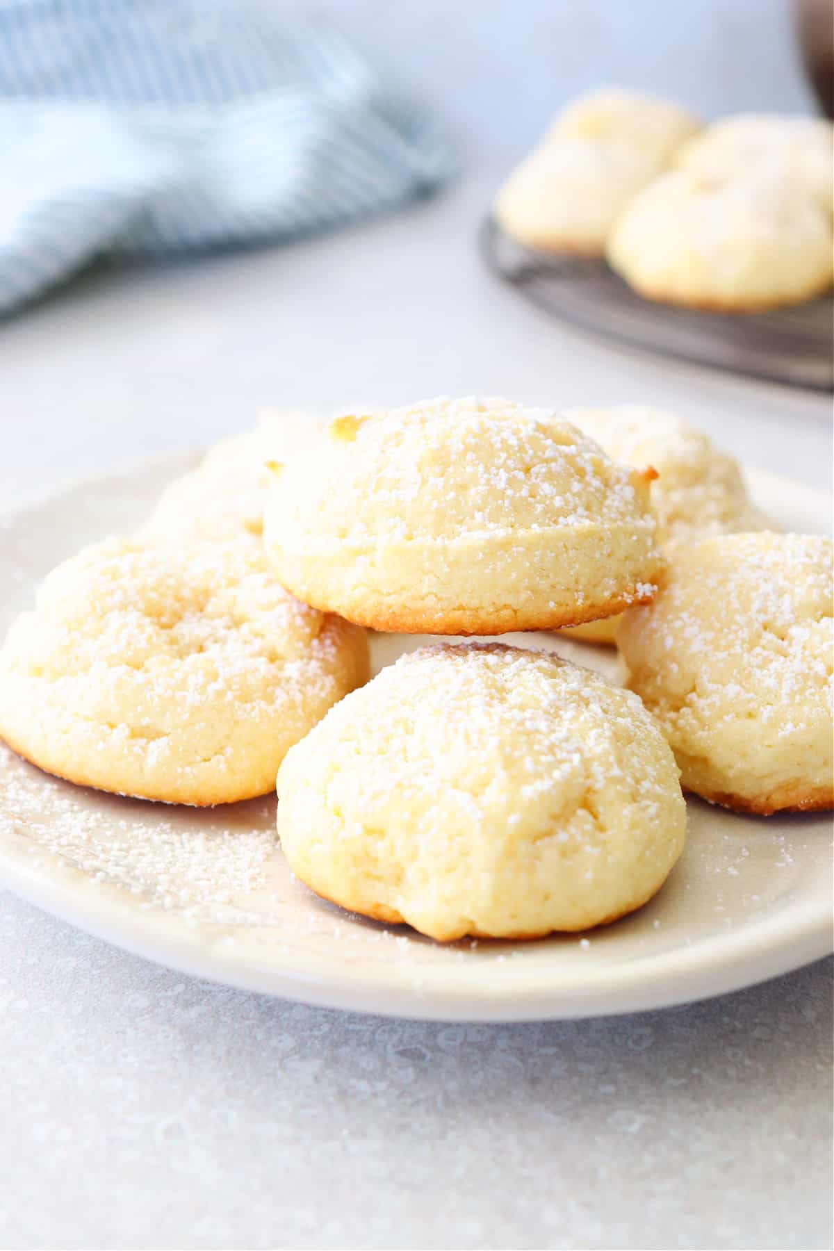 Cream cheese cookies on a small white plate.