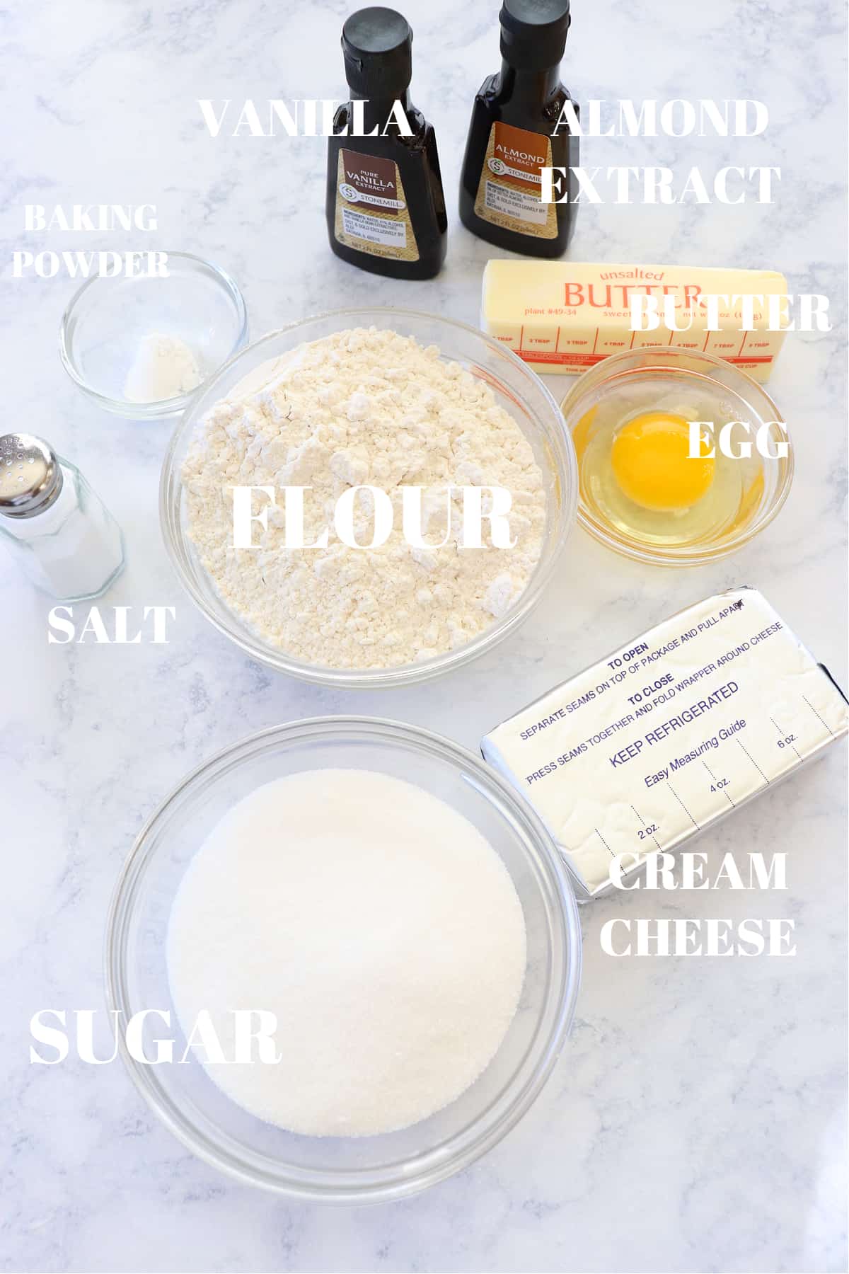 Ingredients for cream cheese cookies on a marble board.