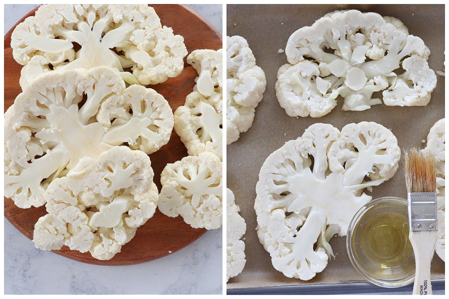 Cauliflower cut into thick slices on a wooden board.