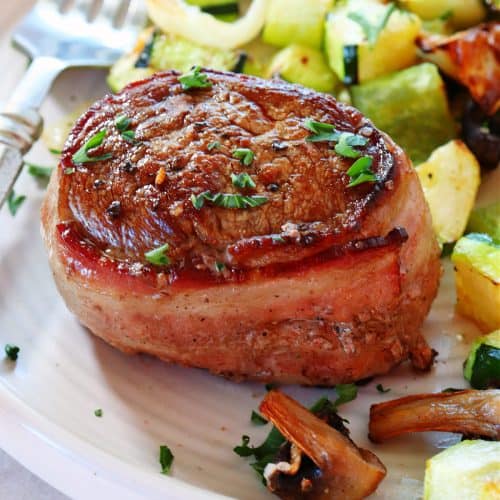 Filet mignon with vegetables on a plate.