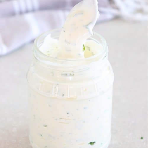 Ranch dressing in a small jar.