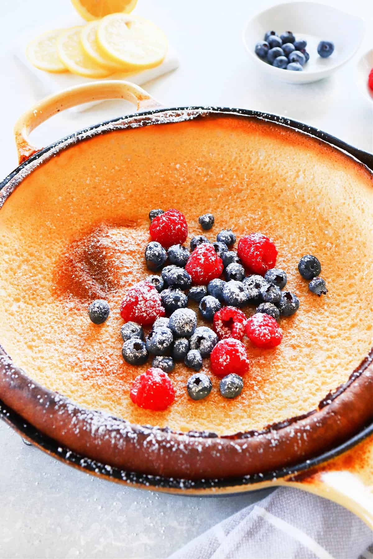 Dutch baby pancake in cast iron pan.