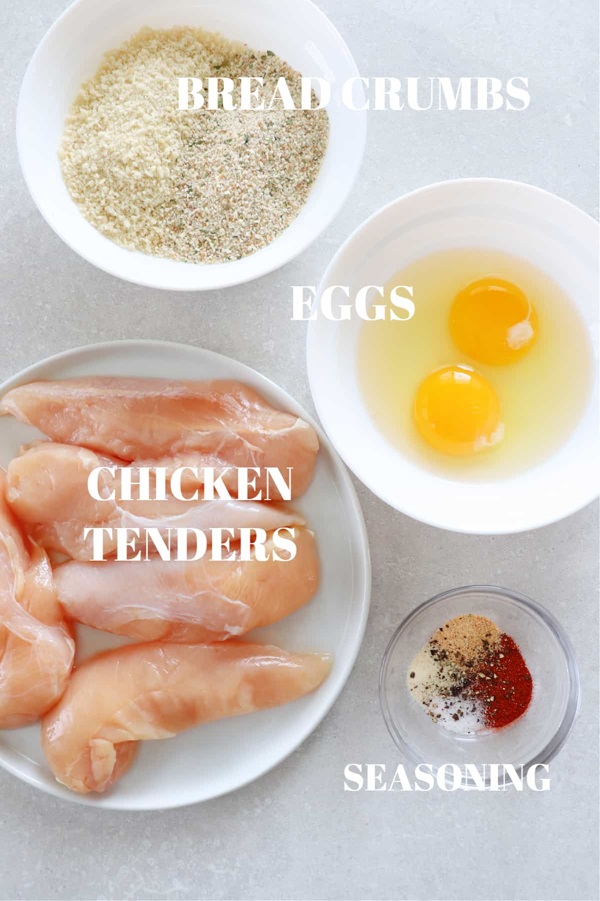 Ingredients for air fryer chicken tenders on a board.