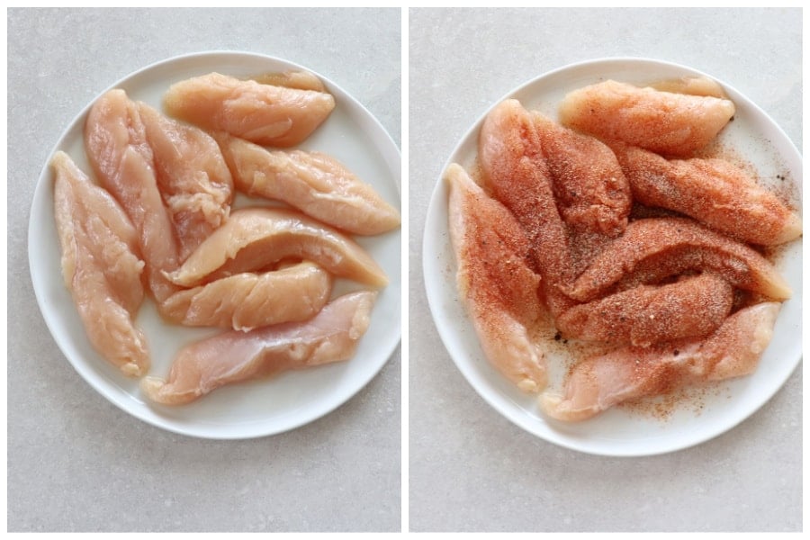 Raw chicken tenders with seasoning on a white plate.