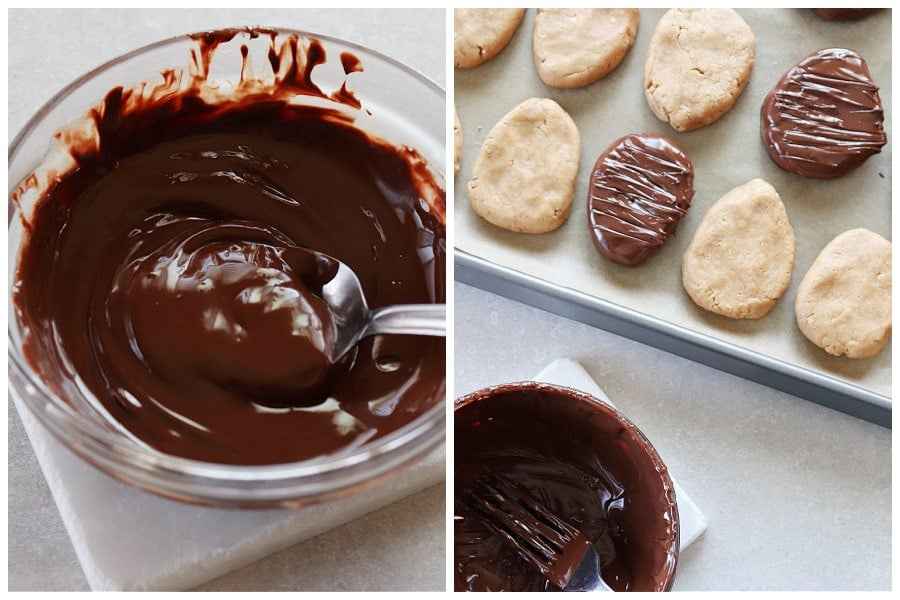 Melted chocolate in a bowl and chocolate covered eggs on a baking sheet.