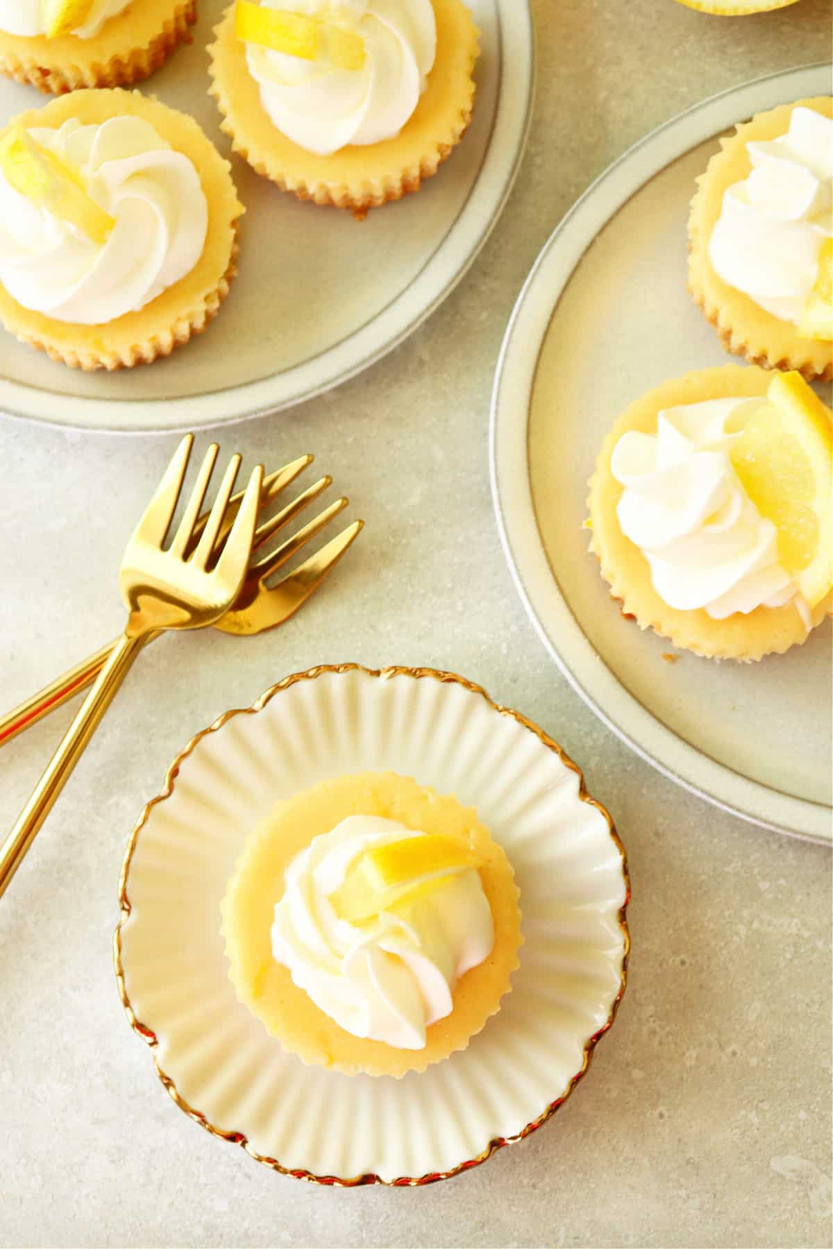 Mini cheesecakes on small plates.