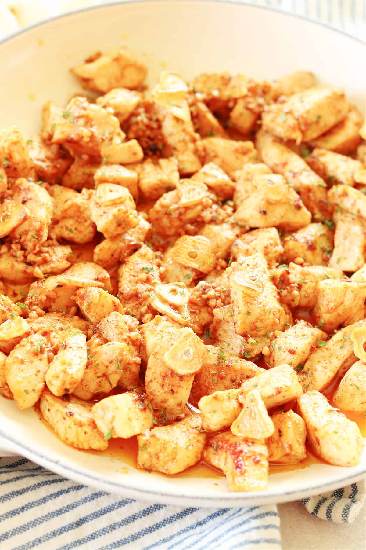 Garlic Butter Chicken. Chicken bites in a pan with garlic and butter sauce.