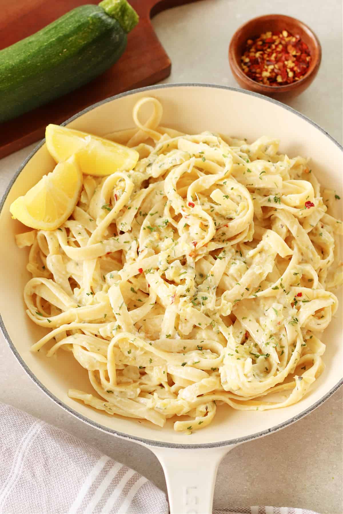 Zucchini pasta in an enameled Le Creuset pan.