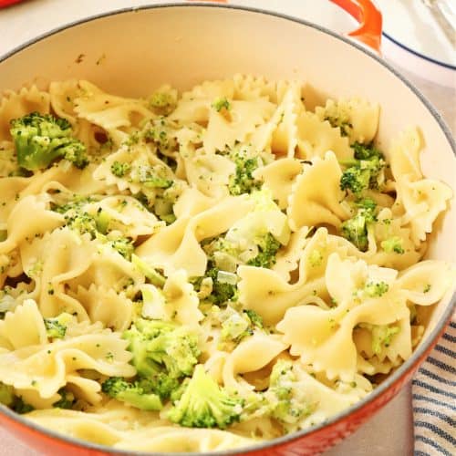 Broccoli pasta in a Le Creuset pan.