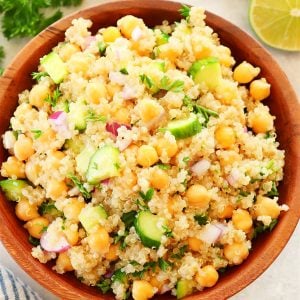 Salad with quinoa and chickpeas in a wooden bowl.