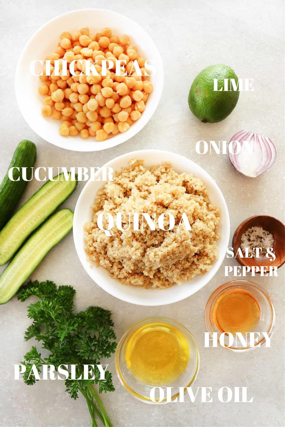 Ingredients for the chickpea quinoa salad on a gray background.
