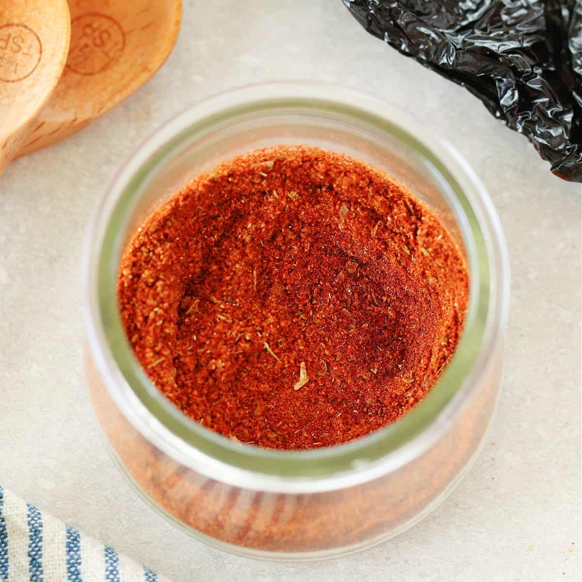 Square photo of seasoning in a small jar.