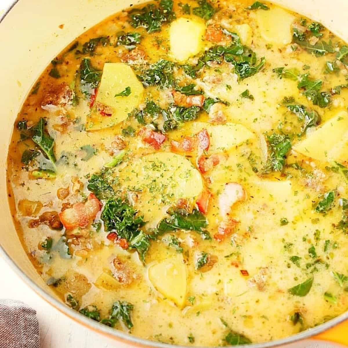 Square image of Zuppa Toscana in a yellow Dutch oven.