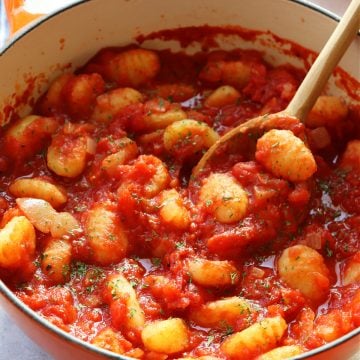 Gnocchi in tomato sauce in a Dutch oven.