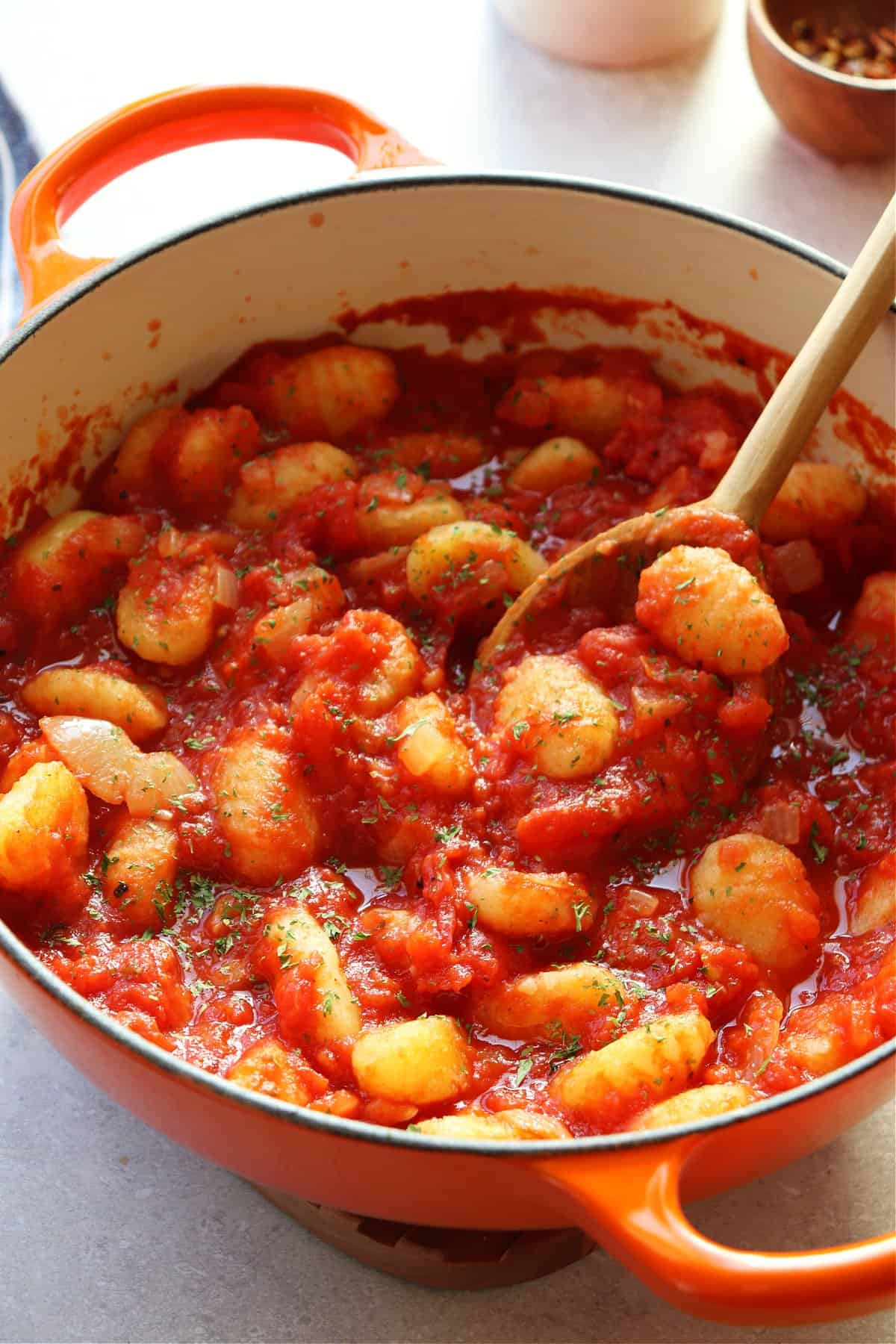 Gnocchi in tomato sauce in a Dutch oven.