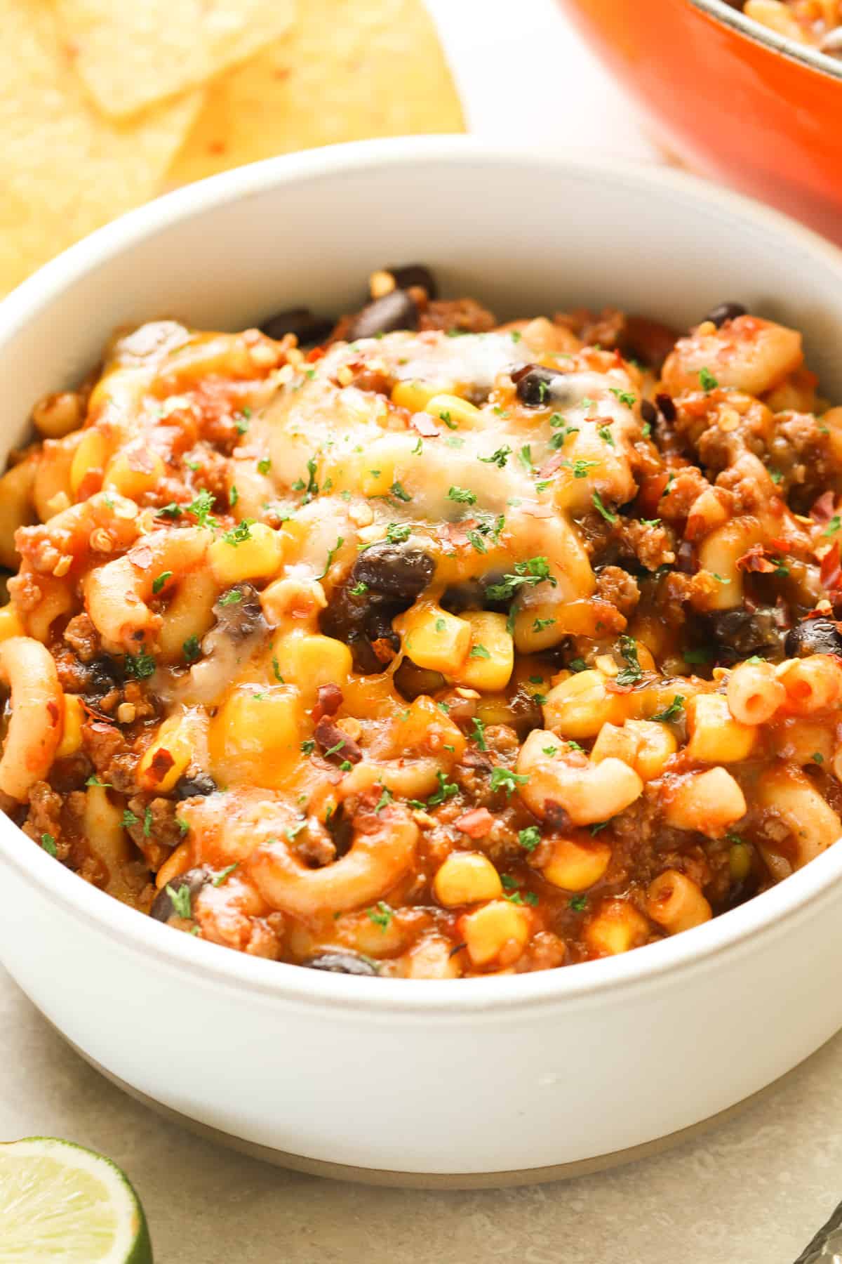 Close up of taco pasta with beef in a white bowl.